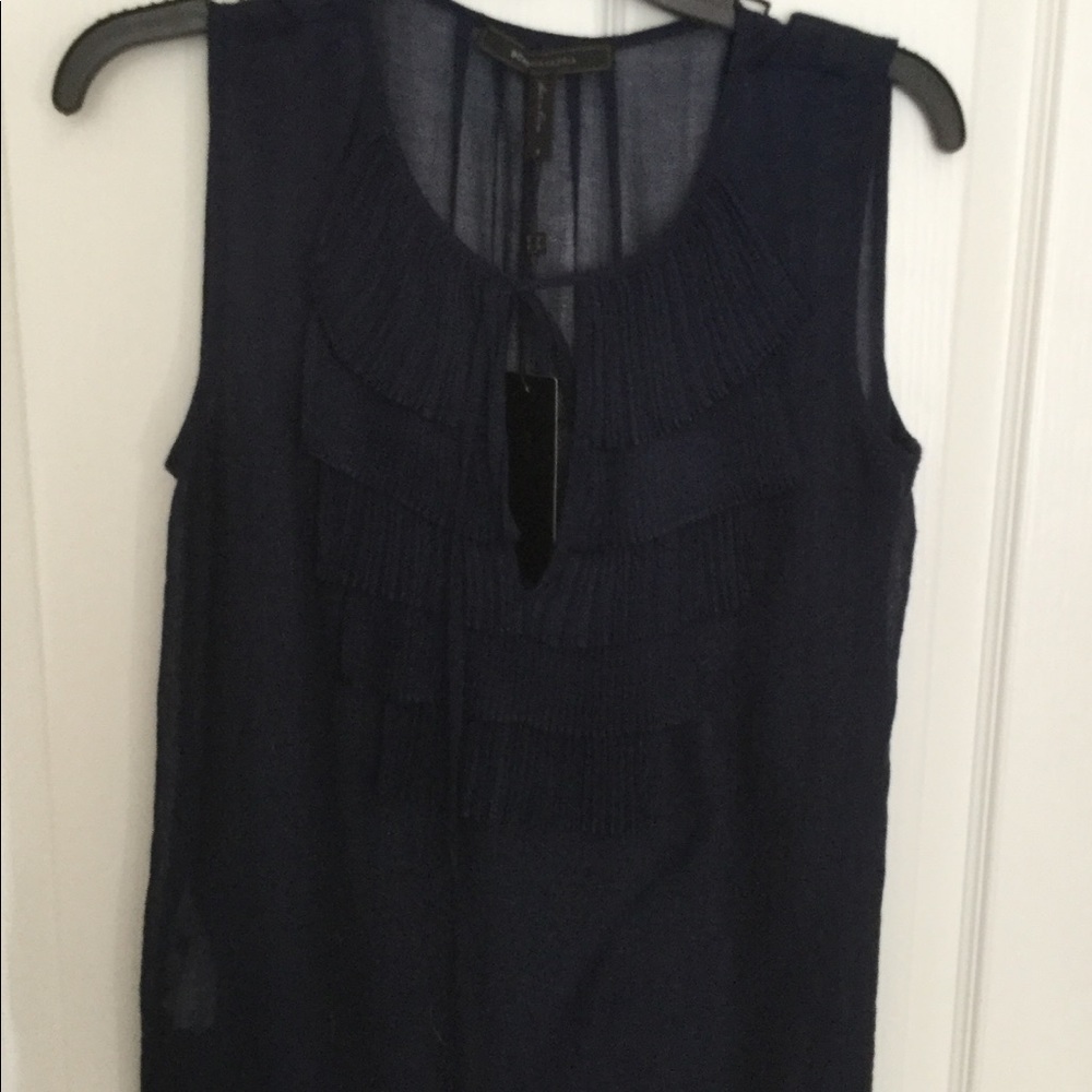BCBG navy blue top with ruffled front and tie.
